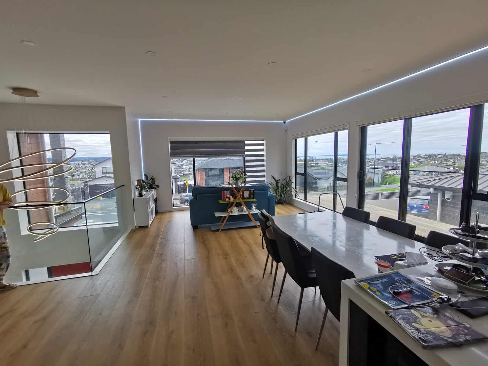 Open-plan living and dining with full-height glazing over the valley, Silverdale
