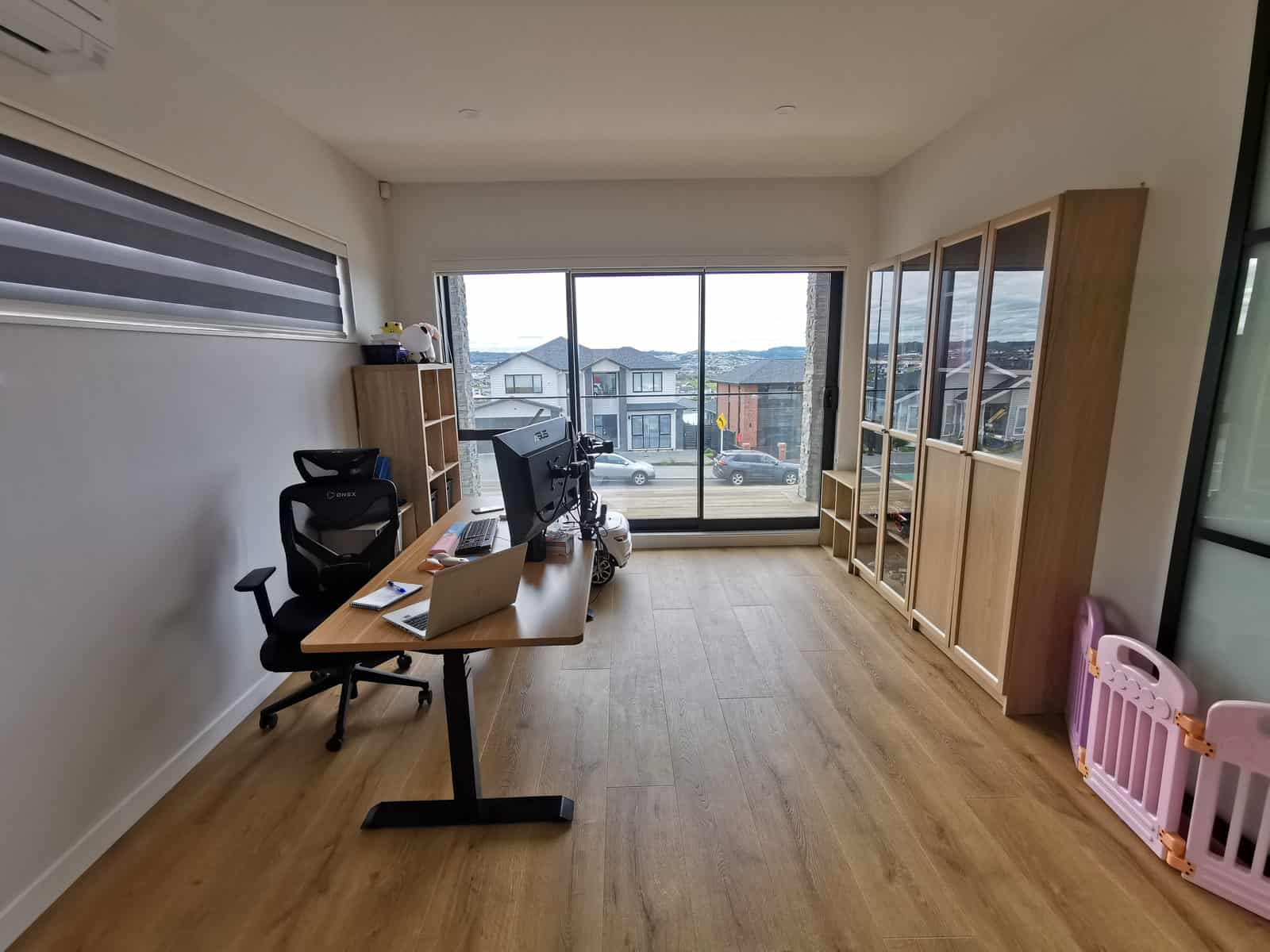 Home office with a desk and shelving beside a wide window, Silverdale