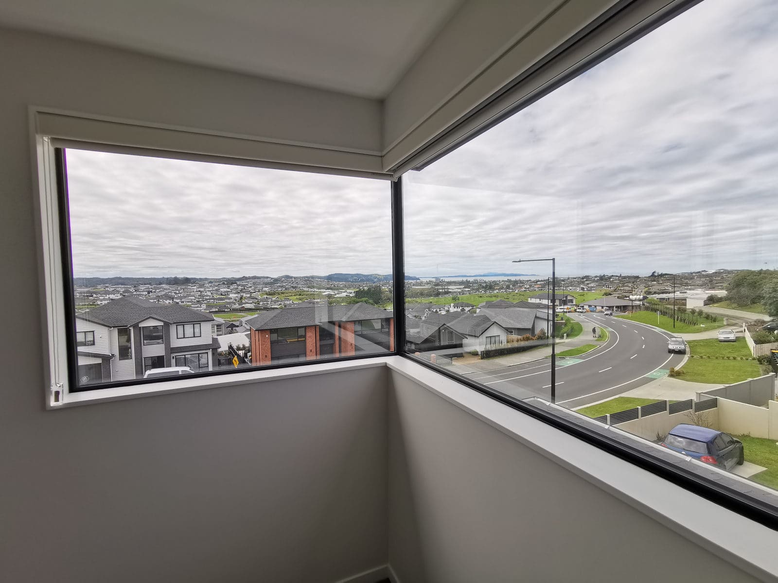 Corner window looking out over the street and the valley beyond, Silverdale