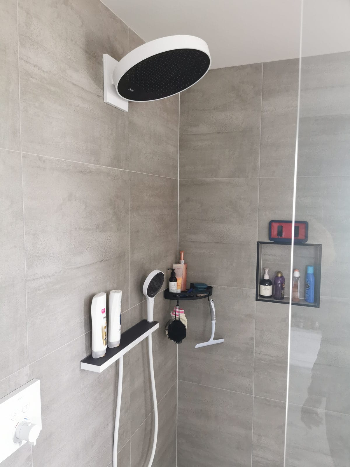 Shower with a ceiling-mounted rain head and grey tiling, Silverdale
