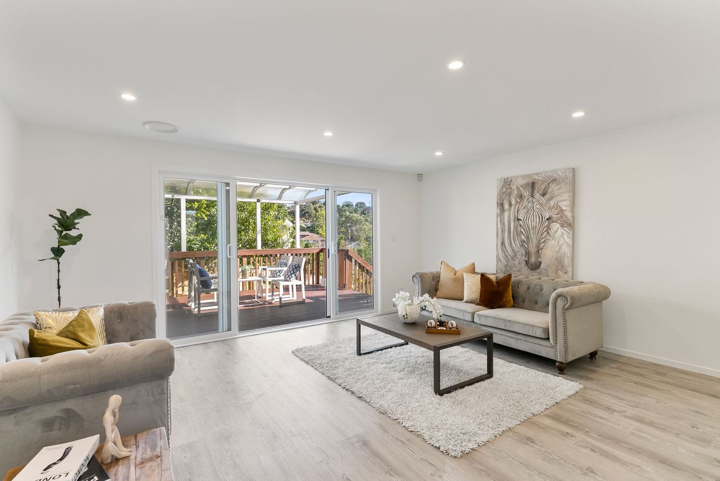 Living room with sofas and sliding doors onto the deck, Sunnynook