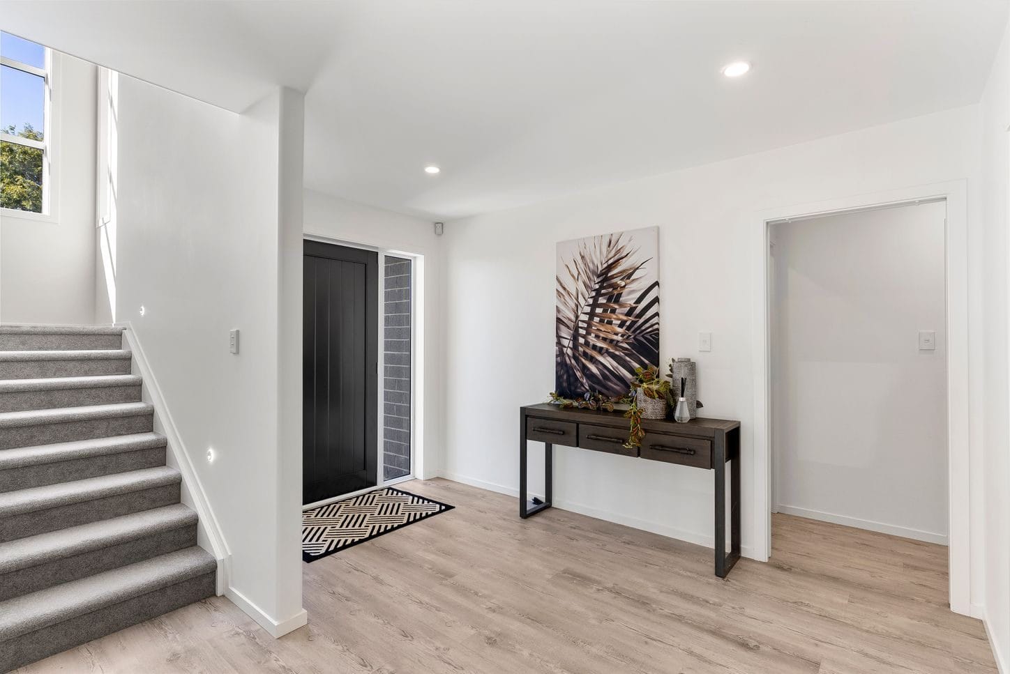 Entry hall with a console table and the stair rising alongside, Sunnynook