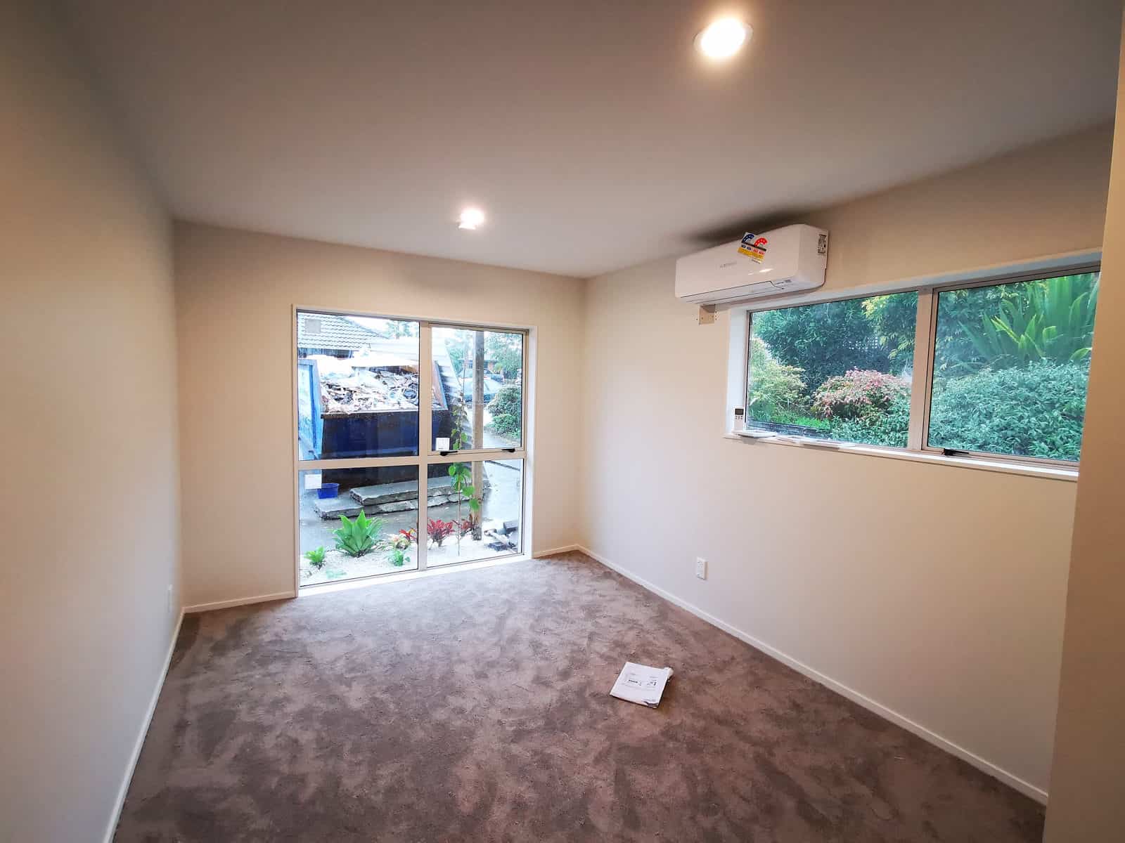 Converted garage room with a sliding door, window and heat pump, The Gardens