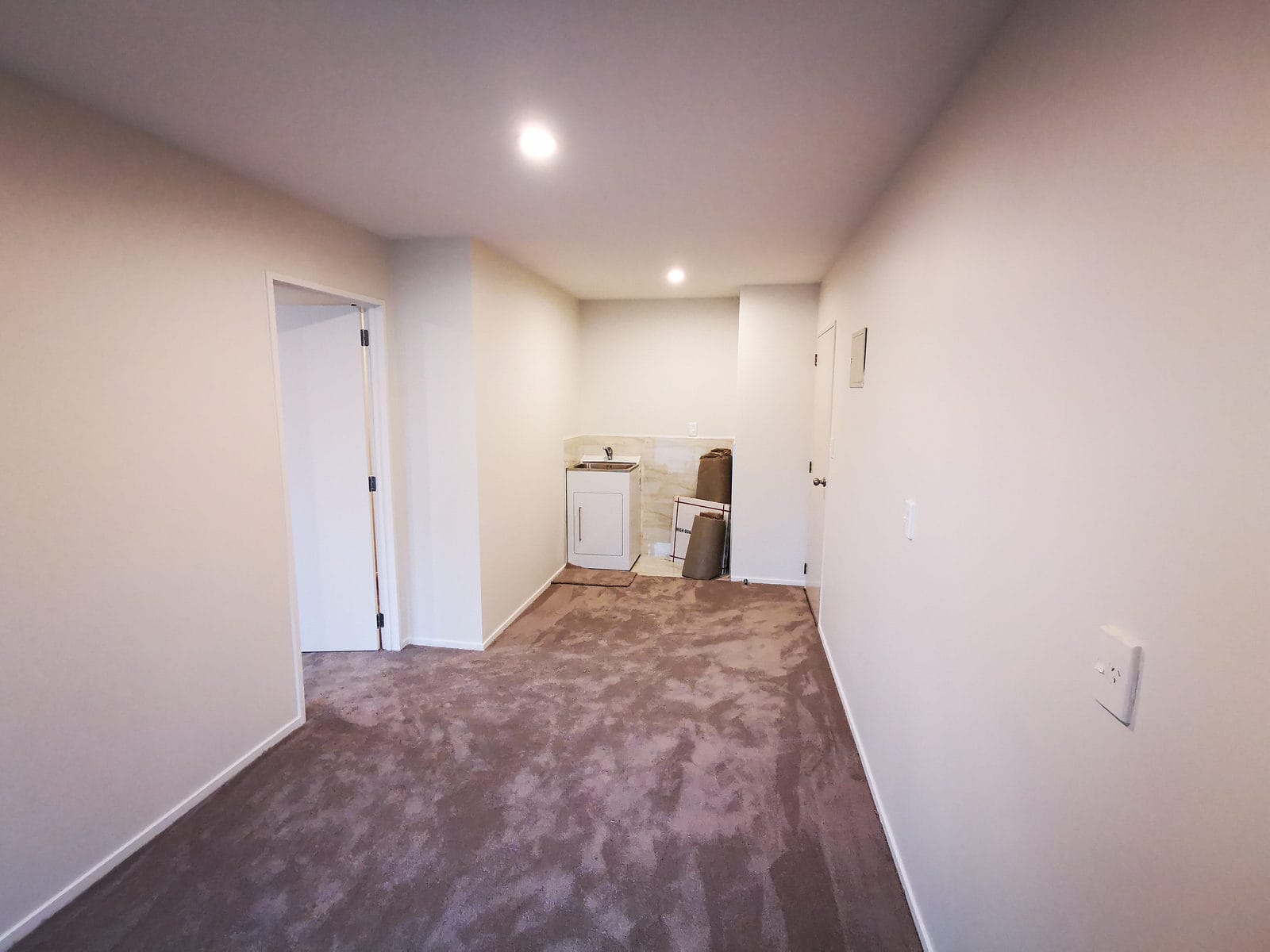 Hallway inside the conversion with a laundry alcove at the end, The Gardens
