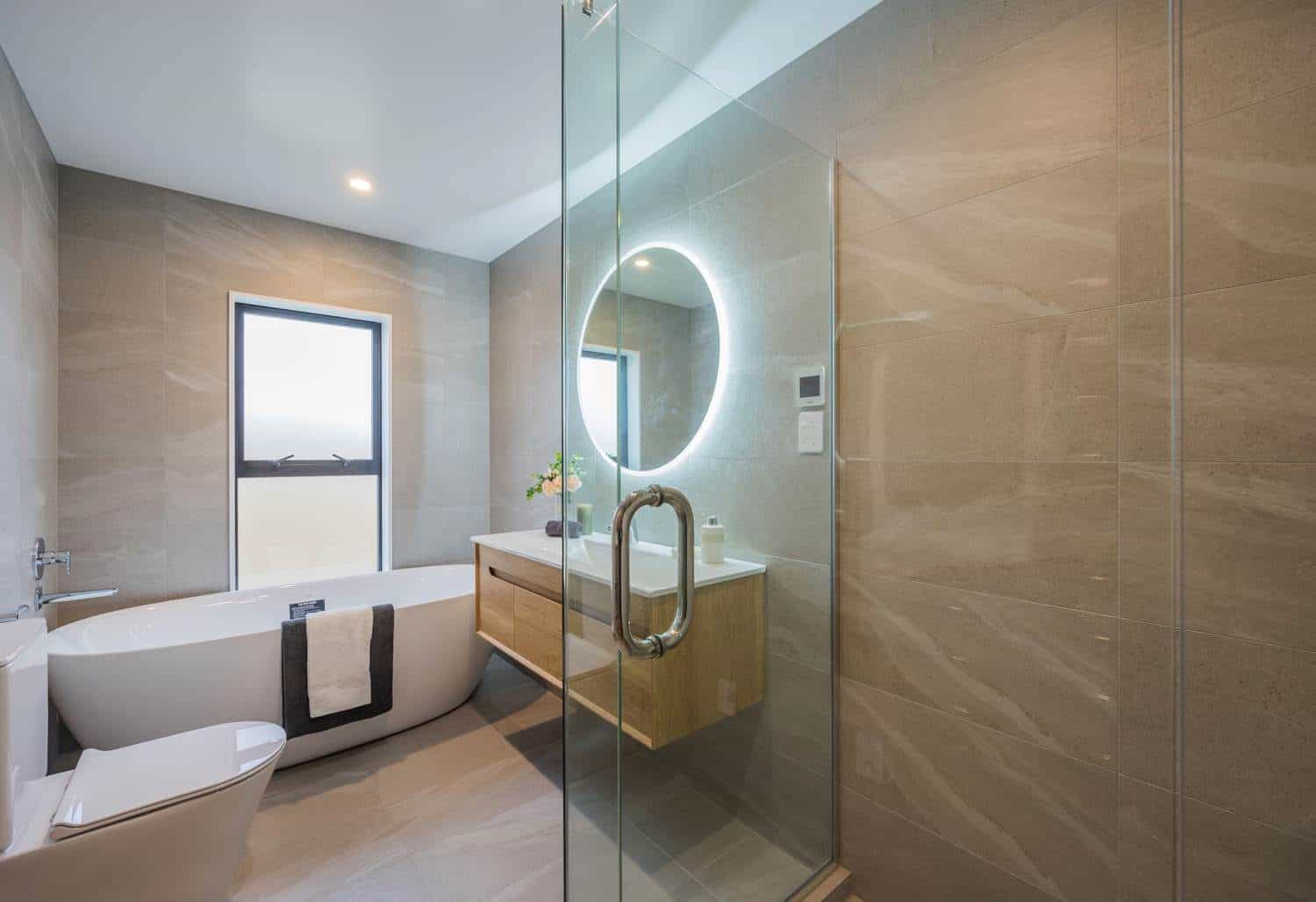 Bathroom with a freestanding bath, backlit round mirror and walk-in shower, Torbay