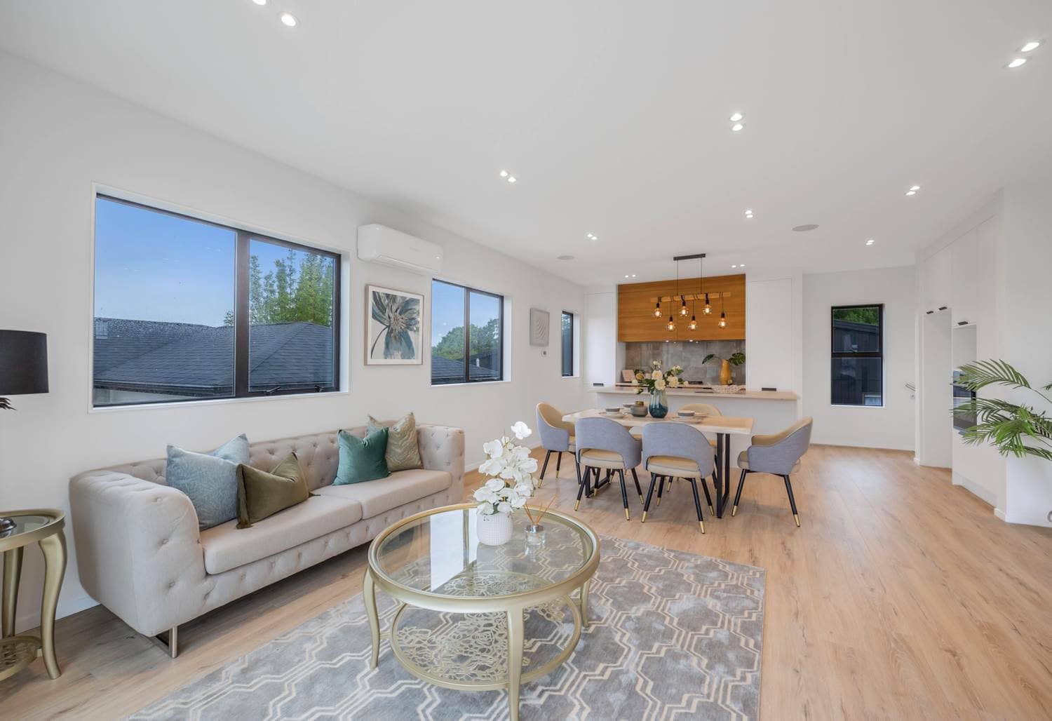 Living room with a sofa and the dining area and kitchen beyond, Torbay
